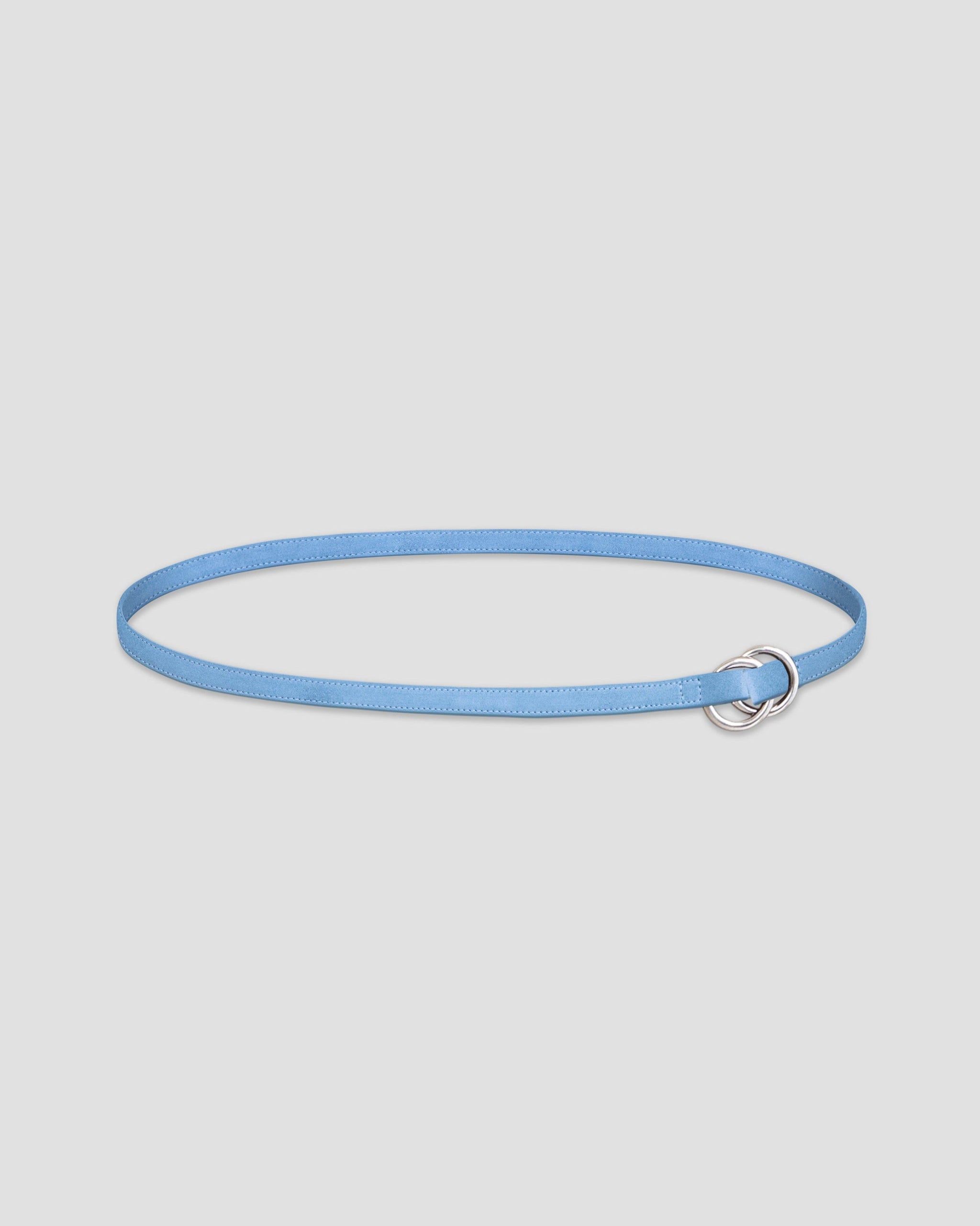 A light blue leather belt with dual metal loop closure on a white background. 